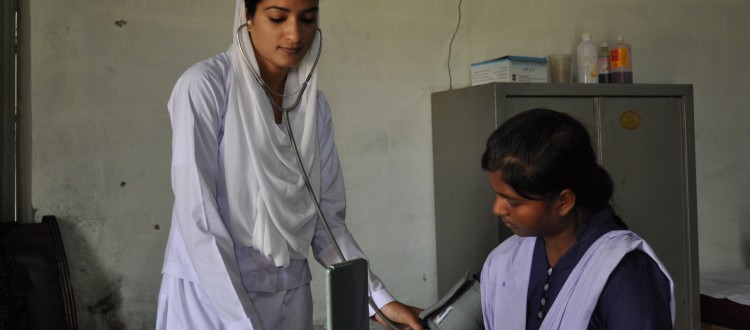 Nazish Mushtaq, a Graduate Nurse of ABC Program, Examines a Student in Machike Boarding School