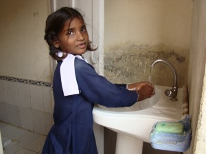 A Student washing Her Hands After Using the Facilities
