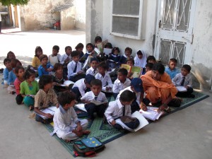 Enthusiasm to Learn Doesn't Deter Children From Sitting on the Floor even Withou a Classroom