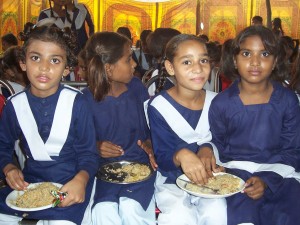 Girls Enjoying a Rice Meal