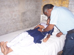 School Health Practitioner Attending to a Student